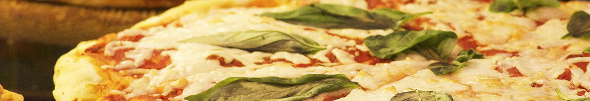 Eating Italian Pizza at Italian Gardens restaurant in Towson, MD.